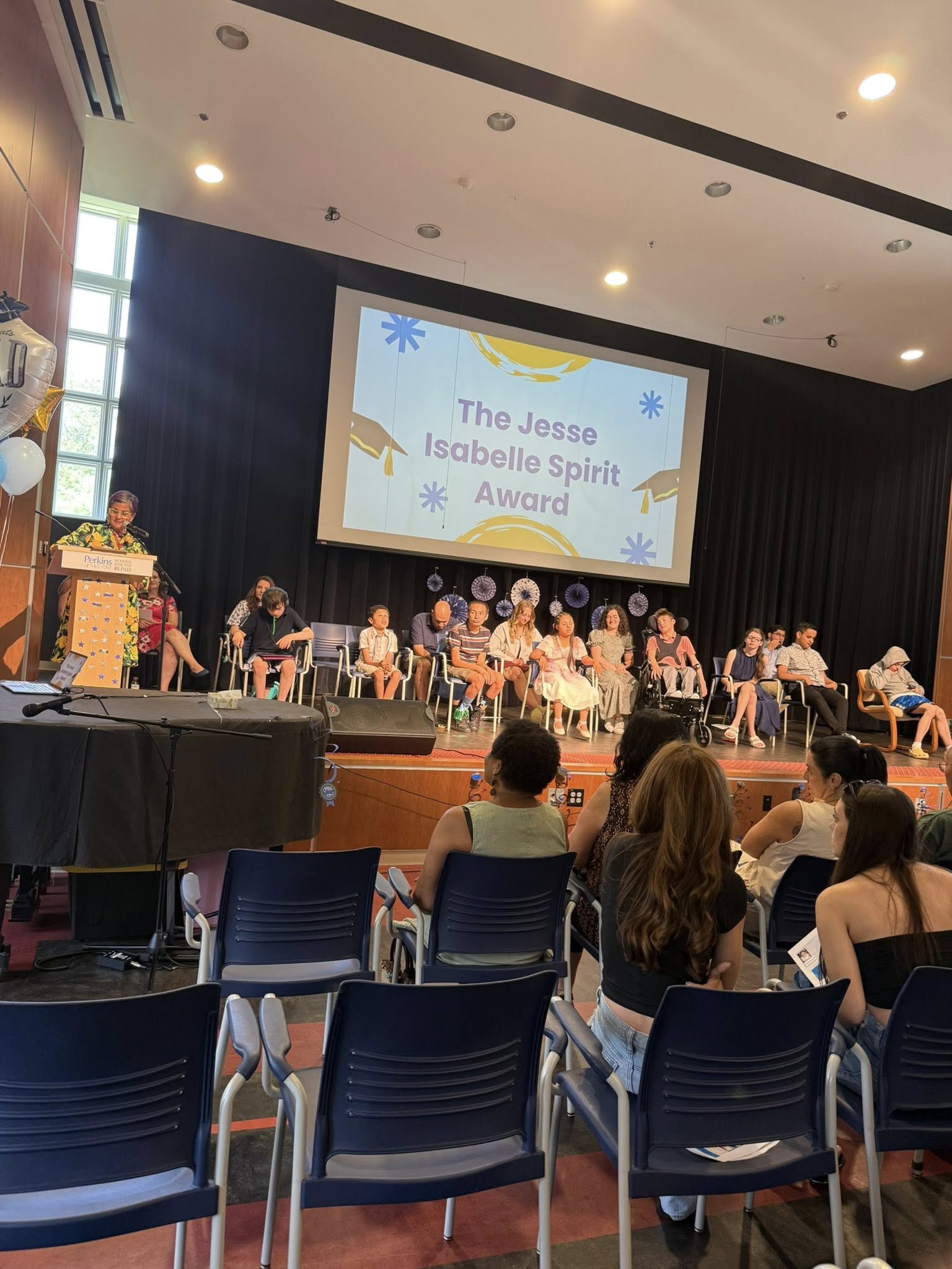 2025 Jesse Isabelle Spirit Award Presentation Carol Podium Stage Projector